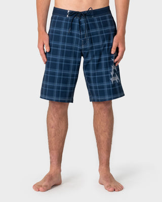 Man wearing Scream Fixed Waist Boardshort in Navy Blue Plaid