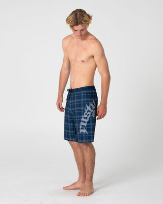 Man wearing Scream Fixed Waist Boardshort in Navy Blue Plaid