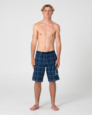 Man wearing Scream Fixed Waist Boardshort in Navy Blue Plaid