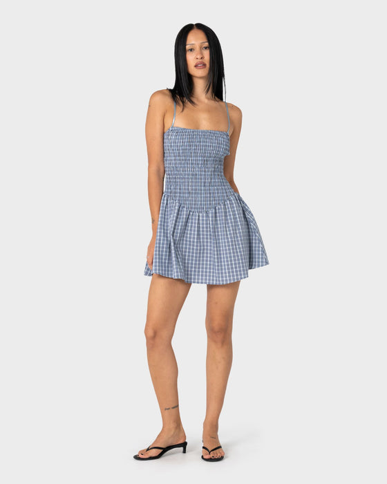 woman-wearing-mimi-smocked-mini-dress-in-blue-check