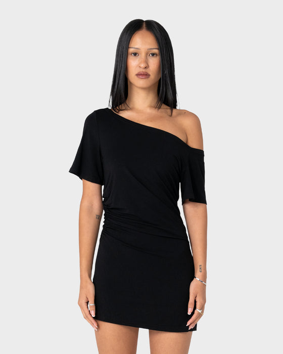 woman-wearing-sally-slouch-off-shoulder-dress-in-black