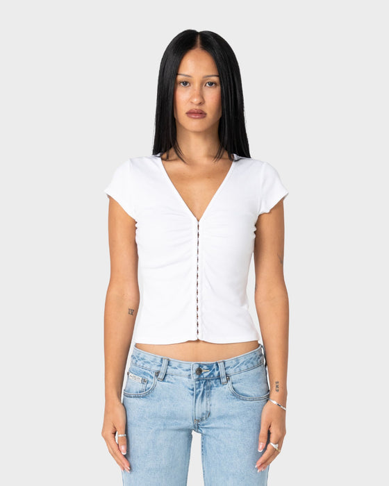 woman-wearing-im-hooked-cap-sleeve-fashion-top-in-white