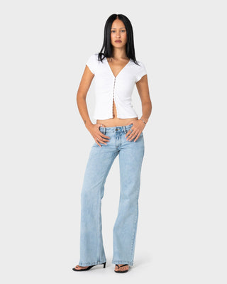 woman-wearing-im-hooked-cap-sleeve-fashion-top-in-white
