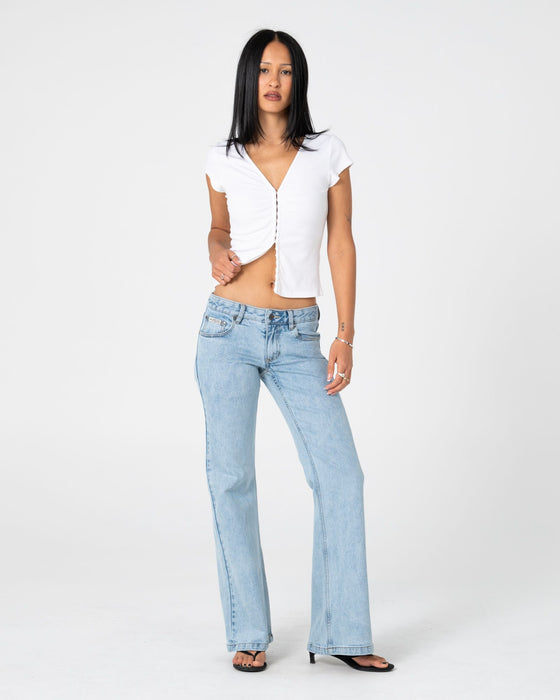 woman-wearing-im-hooked-cap-sleeve-fashion-top-in-white