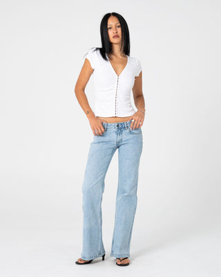 Woman wearing Im Hooked Cap Sleeve Fashion Top in White