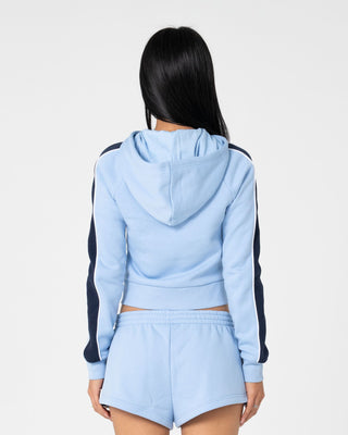 Woman wearing Retro Lines Zip Through Hooded Fleece in Retro Blue