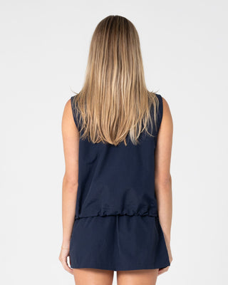 Woman wearing Lombardi Zip Through Nylon Vest in Navy Blue / White