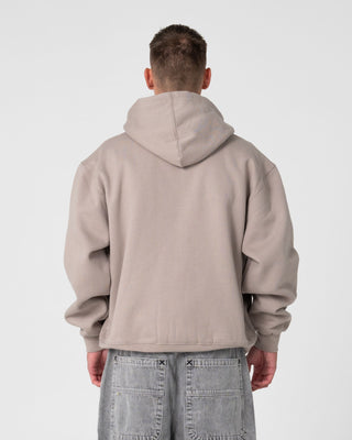 Man wearing Monty 2.0 Zip Thru Hooded Fleece in Stone
