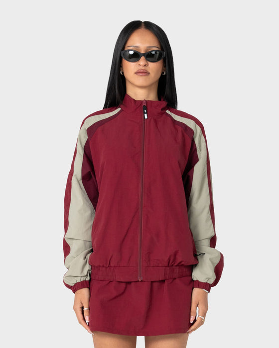 woman-wearing-breezy-wind-cheater-zip-through-jacket-in-cranberry