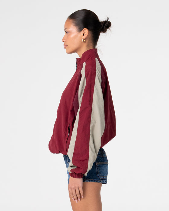 woman-wearing-breezy-wind-cheater-zip-through-jacket-in-cranberry