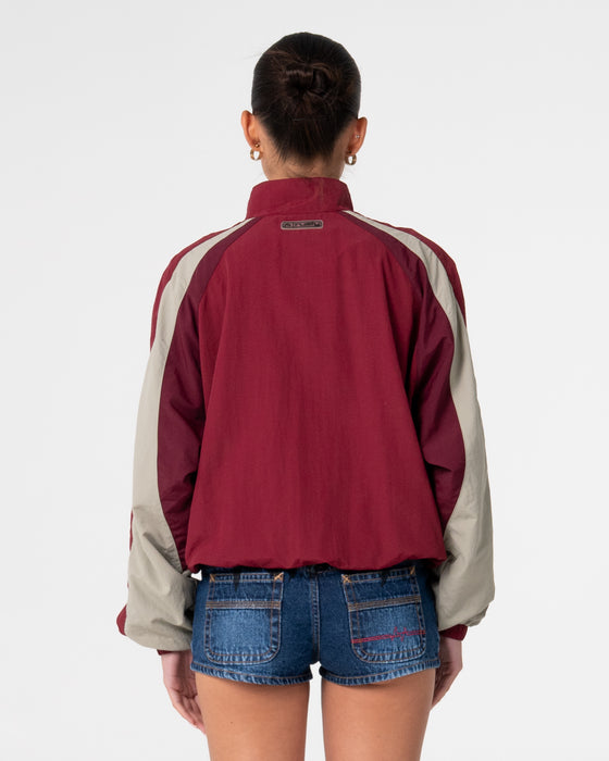 woman-wearing-breezy-wind-cheater-zip-through-jacket-in-cranberry