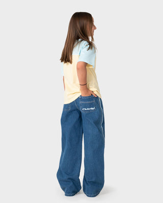 Girl wearing Flip Girl Low Rise Jean in Middy Blue / Blue