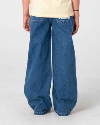 Girl wearing Flip Girl Low Rise Jean in Middy Blue / Blue