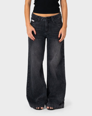 Woman wearing Wendy Wide Low Rise Denim Jean 2.0 in Blasted Black