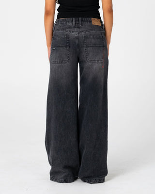 Woman wearing Wendy Wide Low Rise Denim Jean 2.0 in Blasted Black