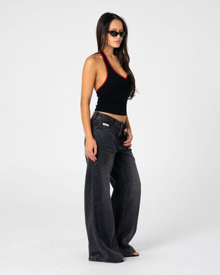 Woman wearing Wendy Wide Low Rise Denim Jean 2.0 in Blasted Black