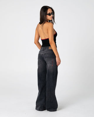 Woman wearing Wendy Wide Low Rise Denim Jean 2.0 in Blasted Black