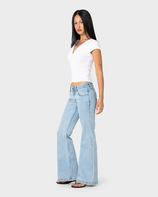 Woman wearing Freida Flare Low Rise Jeans 2.0 in True Blue
