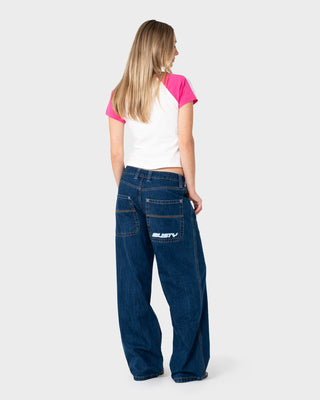 Woman wearing Flip Mommy Low Rise Tapeless Denim 2.0 in Deep Sea Blue