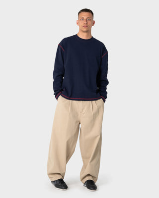 Man wearing Enigma Pleated Pant in Abbey Stone