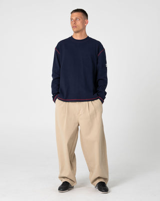 Man wearing Enigma Pleated Pant in Abbey Stone