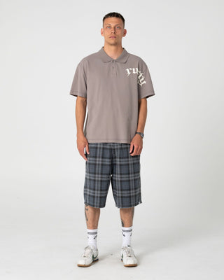 Man wearing Blinker Short Sleeve Polo in Abbey Stone