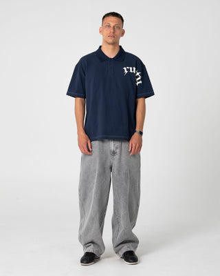 Man wearing Blinker Short Sleeve Polo in Navy Blue