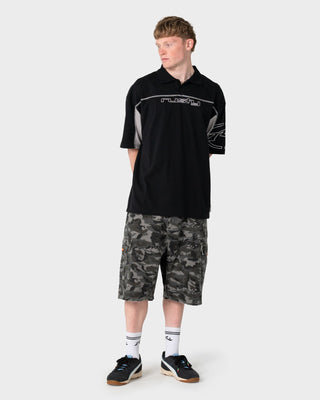 Man wearing Cyberwave Short Sleeve Polo in Black