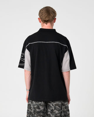 Man wearing Cyberwave Short Sleeve Polo in Black