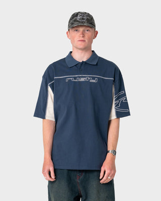 Man wearing Cyberwave Short Sleeve Polo in China Blue