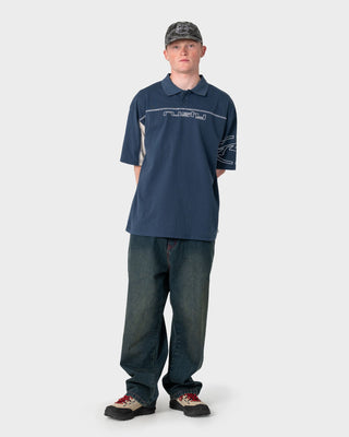 Man wearing Cyberwave Short Sleeve Polo in China Blue