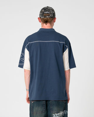 Man wearing Cyberwave Short Sleeve Polo in China Blue