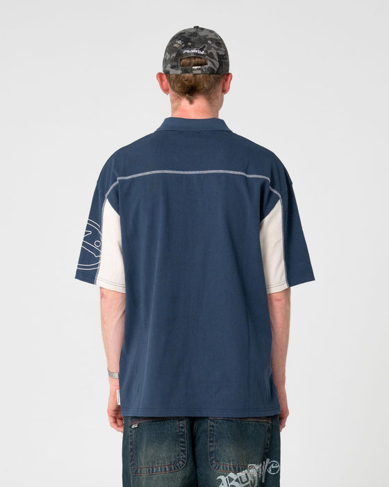 man-wearing-cyberwave-short-sleeve-polo-in-china-blue