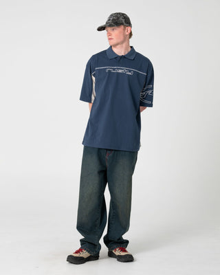Man wearing Cyberwave Short Sleeve Polo in China Blue