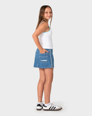 Girl wearing Flip Girl Mini Denim Skirt in Middy Blue / Blue