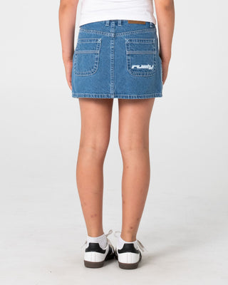 Girl wearing Flip Girl Mini Denim Skirt in Middy Blue / Blue