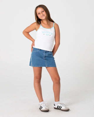 Girl wearing Flip Girl Mini Denim Skirt in Middy Blue / Blue
