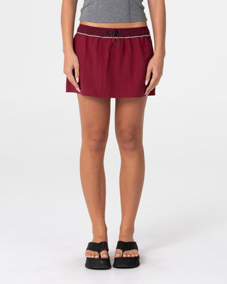 Woman wearing Breezy Wind Cheater Mini Skirt in Cranberry