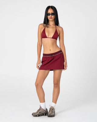 Woman wearing Breezy Wind Cheater Mini Skirt in Cranberry