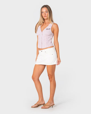 Woman wearing Work It Low Rise Mini Denim Skirt in Snowy White