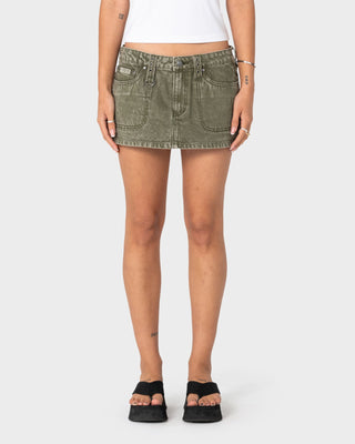 Woman wearing Alley Low Rise Denim Mini Skirt in Savanna