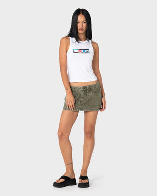 Woman wearing Alley Low Rise Denim Mini Skirt in Savanna