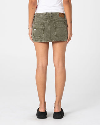 Woman wearing Alley Low Rise Denim Mini Skirt in Savanna