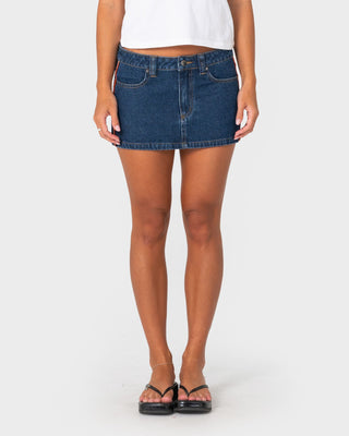 Woman wearing Flip Mommy Low Rise Mini Denim Skirt 2.0 in Deep Sea Blue / Orange