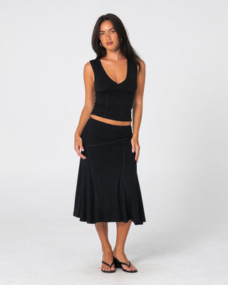 Woman wearing Vixen Low Rise Midi Skirt in Black