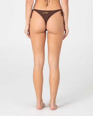 Woman wearing La Cabana Brazilian Side Tie Bikini Pant in Java