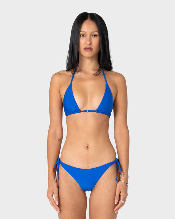 woman-wearing-shadow-multiway-ring-bikini-top-in-cobalt-blue