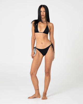 Woman wearing Cedar Multiway Bikini Top in Black