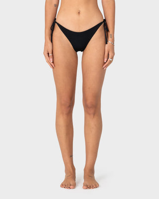 Woman wearing Cedar Midi Side Ties Bikini Bottom in Black