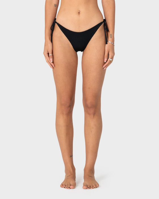 woman-wearing-cedar-midi-side-ties-bikini-bottom-in-black